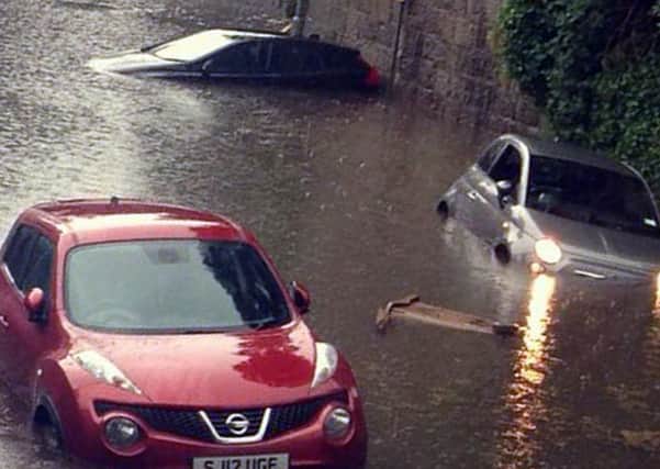 Cars are caught in flash flooding on Polmuir Road in Aberdeen after torrential rain hit the city. Picture: Hemedia