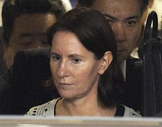 Julie Hamp leaves a Tokyo police station yesterday. Picture: AP
