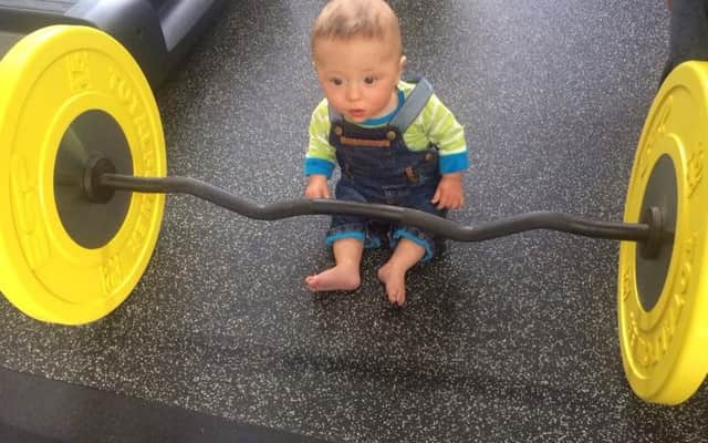 Chris Hoy takes the shot of his baby son as he works out at the gym. Picture: Twitter