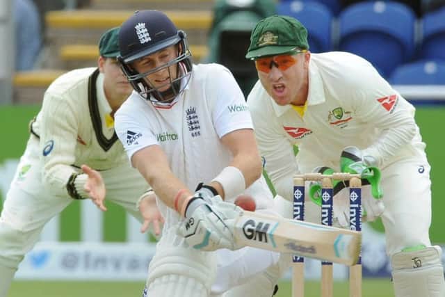 Australia wicketkeeper Brad Haddin watches as Joe Root plays a shot during the opening day of the Ashes series in Cardiff. Picture: AP