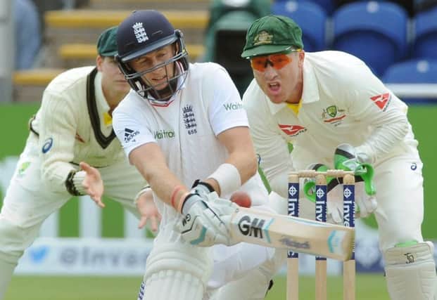 Australia wicketkeeper Brad Haddin watches as Joe Root plays a shot during the opening day of the Ashes series in Cardiff. Picture: AP