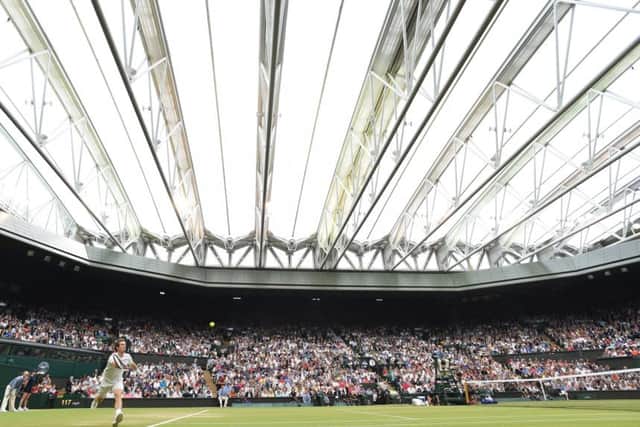 Andy Murray in action under the roof of Wimbledons Centre Court. Picture: Ian Rutherford
