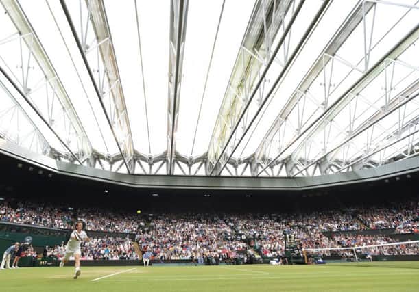 Andy Murray in action under the roof of Wimbledons Centre Court. Picture: Ian Rutherford