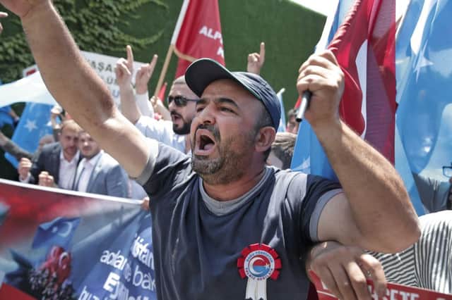 Uighurs living in Turkey protest near Beijings consulate in Istanbul against the treatment of their people in China. Picture: AP