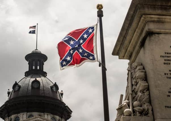 The Confederate flag flies in the statehouse grounds in South Carolina but its days are numbered. Picture: Getty