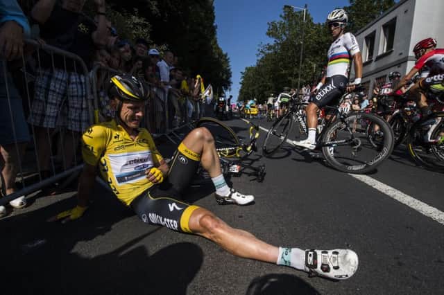 Tony Martin lies hurt after a crash 900 metres from the end of yesterdays stage. Picture: Getty