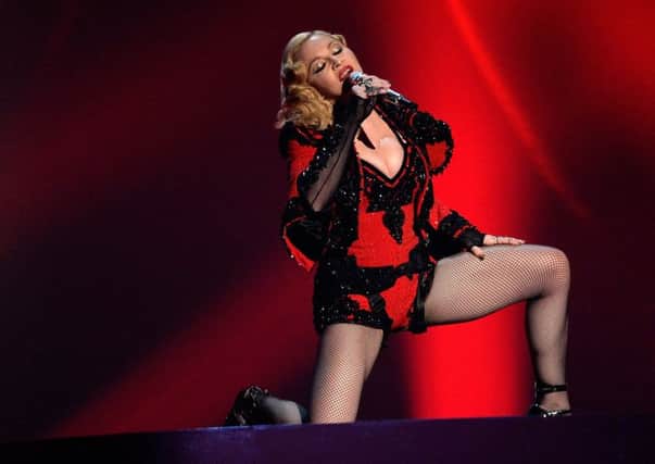 Madonna, who must know a thing or two about fitness regimes, has been shamed for her insistence in prancing around in corsets at the age of 56. Picture: Getty