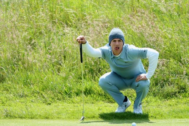 Thorbjorn Olesen lines up his putt on the 18th hole during the first round of the Scottish Open at Gullane. Picture: Getty