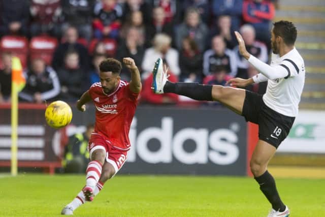 Shaleum Logan (left) and Shkendija's Stenio Junior at Pittodrie. Picture: PA
