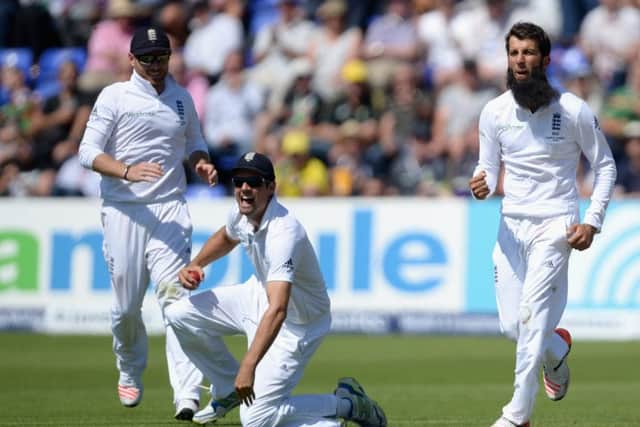 Alastair Cook catches Steve Smith off the bowling of allrounder Moeen Ali, right. Picture: Gareth Copley/Getty