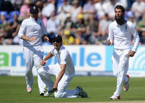 Alastair Cook catches Steve Smith off the bowling of allrounder Moeen Ali, right. Picture: Gareth Copley/Getty