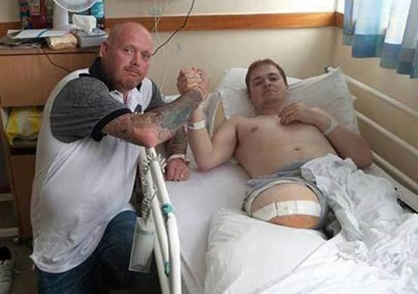 Paul Buchan pictured in hospital with the cook who saved his life. Picture: Hemedia