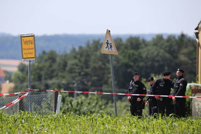 Policemen stand at the crime scene in Tiefenthal-Leutershausen near Ansbach. Picture: AFP/Getty