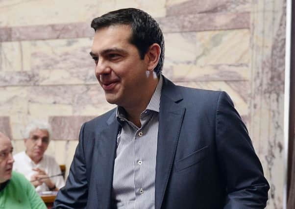 Greek Prime Minister Alexis Tsipras arrives to address his parliamentary group. Picture: AFP/Getty