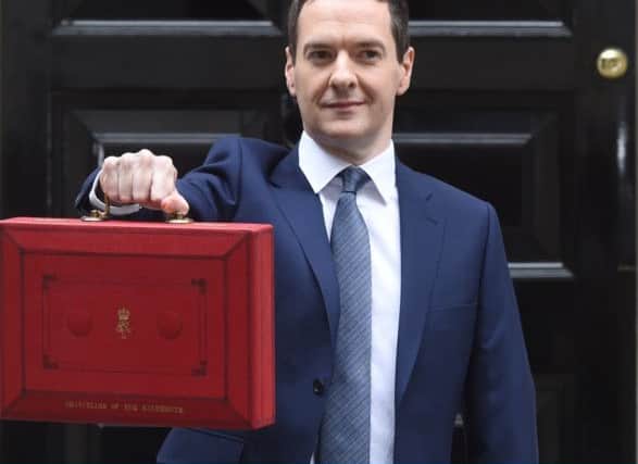 George Osborne holds his ministerial red box. Picture: Getty