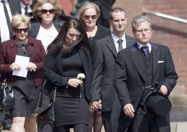 Stuart McQuire, second right, the son of Jim and Ann McQuire, with his wife Nicola, third right. Picture: PA