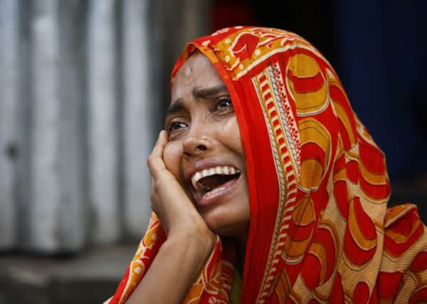 Momotaj Begum, mother of Rubi Akhtar, 12, who died in a stampede, cries at her home in the town of Mymensingh. Picture: AP