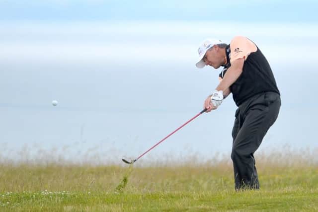 Leading Scot Paul Lawrie plays out of the rough on the 13th hole at Gullane yesterday. Picture: Jane Barlow