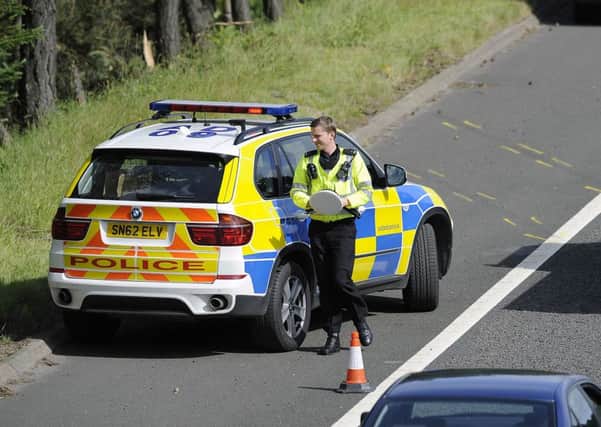 Police near the scene of the tragic accident that has put Police Scotland and its boss in the spotlight. Picture: Michael Gillen
