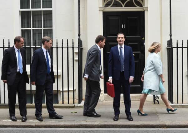 George Osborne and his Treasury team leave Downing Street before last weeks Budget, which contained a few Labourinspired surprises. Picture: Getty Images