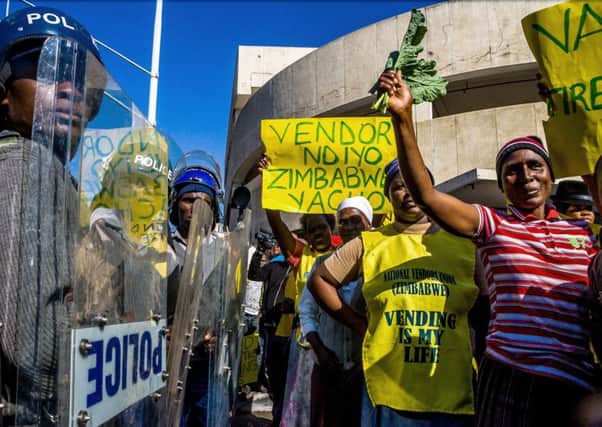 Traders demonstrate in Harare against the Mugabe regimes plans to evict them from unlicensed city pitches. Picture: Getty Images