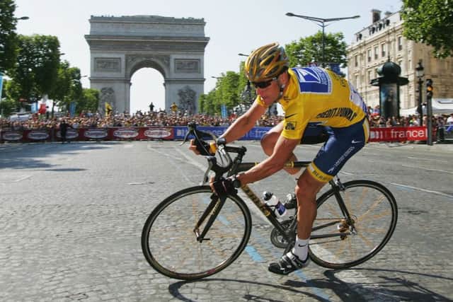 Lance Armstrong in Paris on his way to winning his sixth Tour. Armstrong returns to France for a charity ride this week. Picture: Getty