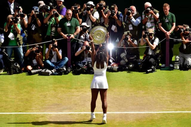Serena Williams celebrates Trophy following her victory in the ladies singles final. Picture: PA