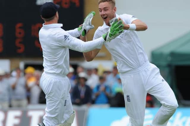 Stuart Broad celebrates with keeper Jos Buttler after bowling Australias Steve Smith. Picture: AP
