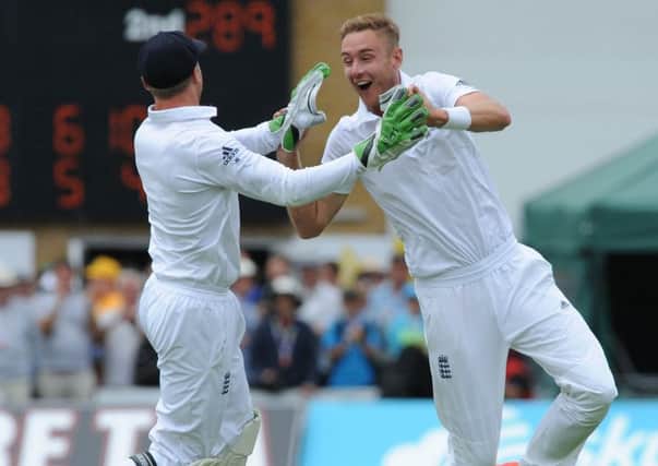 Stuart Broad celebrates with keeper Jos Buttler after bowling Australias Steve Smith. Picture: AP
