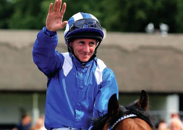 Jockey Paul Hanagan celebrates after winning The Darley July Cup on Muhaarar. Picture: PA