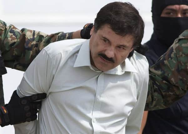 Joaquin Guzman after his recapture last year. He had escaped from another maximumsecurity jail with the help of prison staff in 2011. Picture: AP