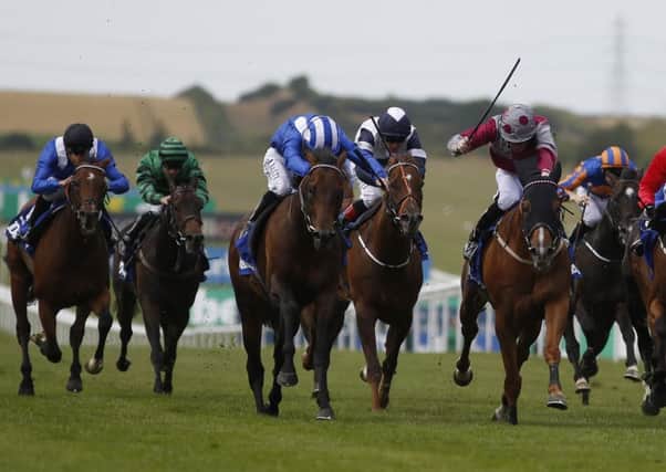 Paul Hanagan on Muhaarar, left, edges out the gallant Tropics, right, to win the July Cup at Newmarket. Picture: Getty