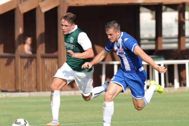 Scott Allan returned to La Manga in time to play in Hibs bounce match against Wigan, above, after visiting his new baby son, Zac. Picture: Eric McCowat