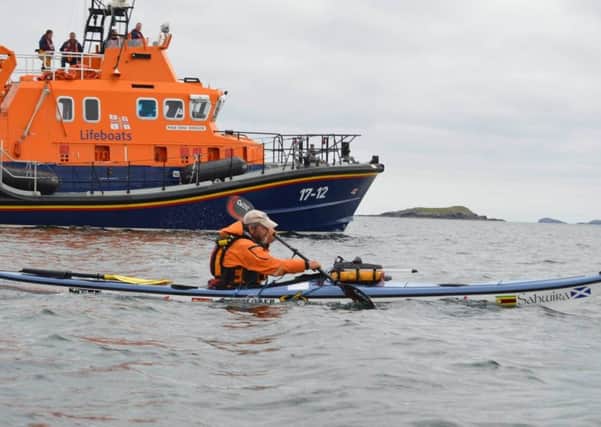 An RNLI lifeboat catches up with Nick Ray as he visits its 47 stations, mostly unaccompanied. Picture: Contributed