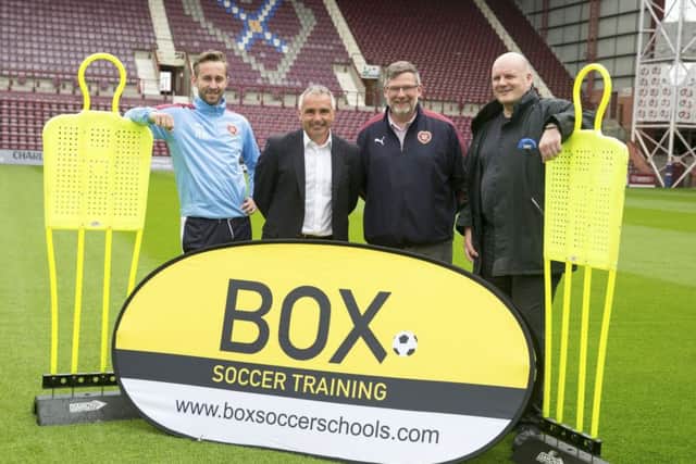 Craig Levein joins, from left, academy manager Roger Arnott, Box Training director John Colquhoun and David Smith, director of ARC (Scotland) Ltd, as Hearts prepare to introduce the specialist training programme at their Riccarton youth academy. Picture: SNS