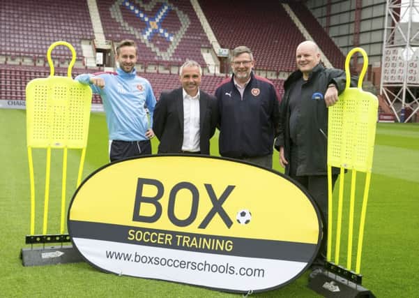 Craig Levein joins, from left, academy manager Roger Arnott, Box Training director John Colquhoun and David Smith, director of ARC (Scotland) Ltd, as Hearts prepare to introduce the specialist training programme at their Riccarton youth academy. Picture: SNS