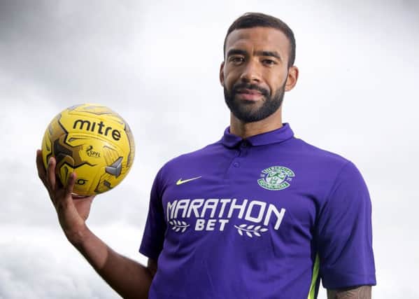 Hibernian defender Liam Fontaine unveils the club's new away kit. Picture: SNS