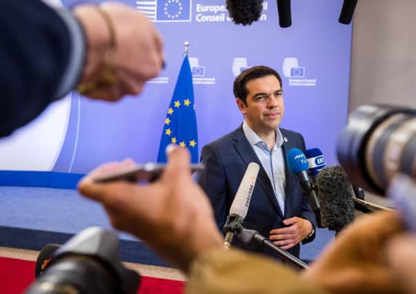 Greek prime minister Alexis Tsipras speaks with the media after a meeting of eurozone heads of state at the EU Council building in Brussels on Monday. Picture: AP