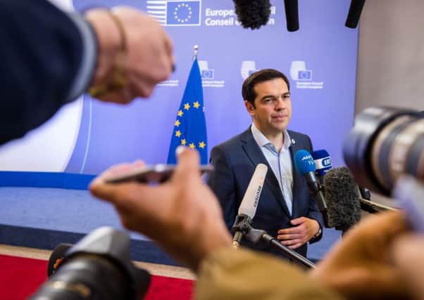 Greek Prime Minister Alexis Tsipras speaks with the media on Monday July 13. Picture: AP