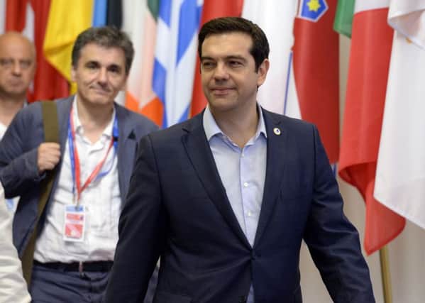 Greek prime minister Alexis Tsipras and his finance minister, Euclide Tsakalotos, in Brussels. Picture: AP