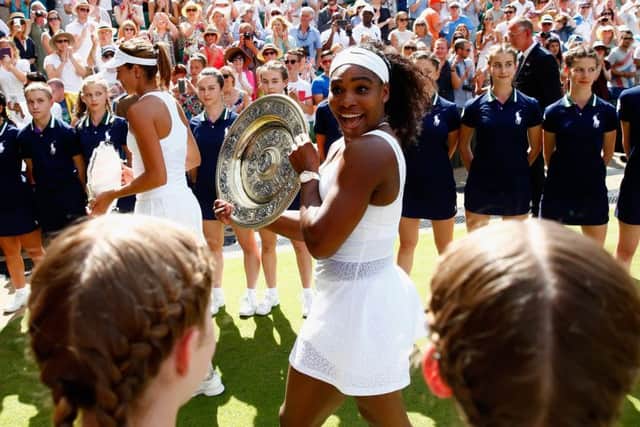 Serena Williams parades the Venus Rosewater Dish after her victory against Garbine Muguruza at Wimbledon. Picture: Getty Images