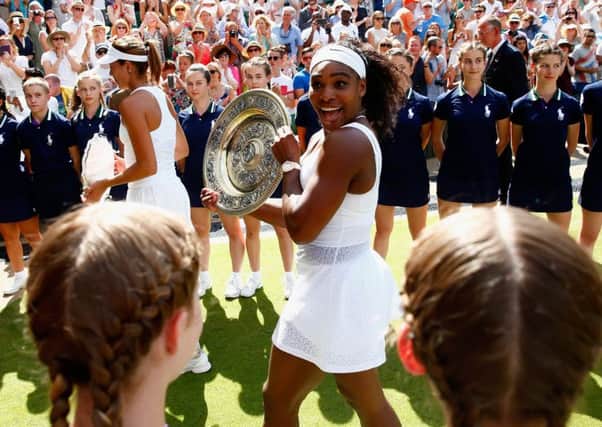 Serena Williams parades the Venus Rosewater Dish after her victory against Garbine Muguruza at Wimbledon. Picture: Getty Images