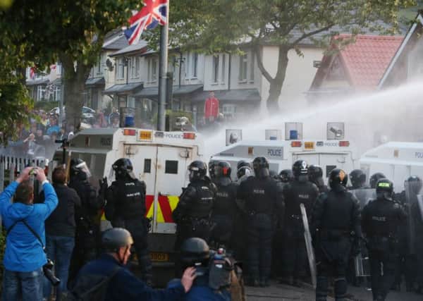 Water cannon is used on Loyalist protesters on the Crumlin Road, Belfast. Picture: Brian Lawless/PA Wire