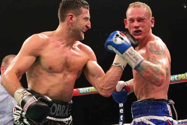 Carl Froch (left) punches George Groves in what turned out to the final fight of his career. Picture: PA