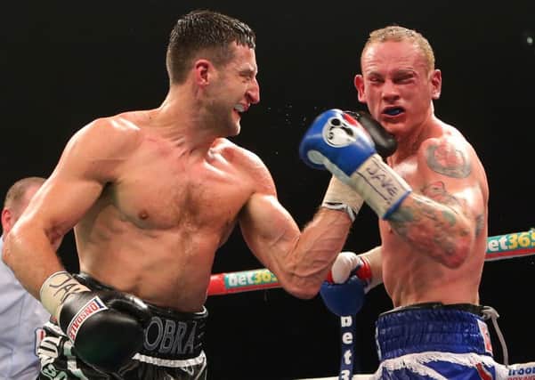 Carl Froch (left) punches George Groves in what turned out to the final fight of his career. Picture: PA