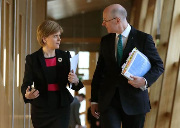 Should Nicola Sturgeon and John Swinney prepare themselves for lengthy applause? Picture: Andrew Milligan