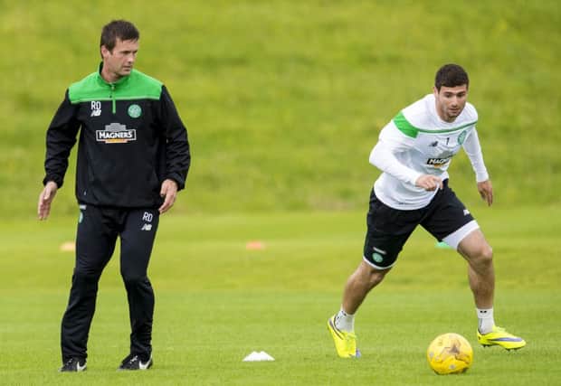 Celtic boss Ronny Deila watches his new signing Nadir Ciftci in training at Lennoxtown. Picture: SNS