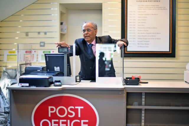 Dr Manzoor Alam inside the newly reopened Sanquhar post office. Picture: Getty Images