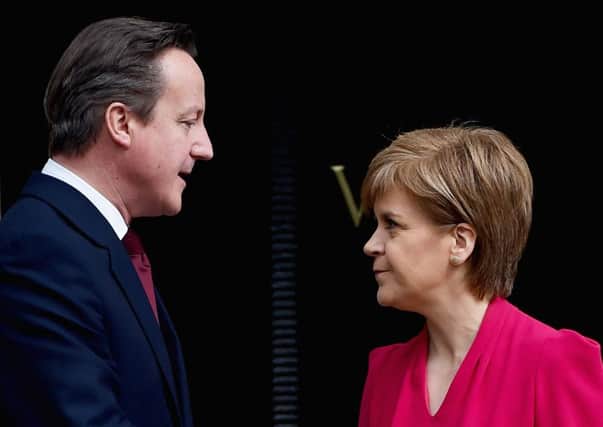 David Cameron and Nicola Sturgeon have butted heads over the SNP's plans to bulk vote against fox hunting changes. Picture: Getty