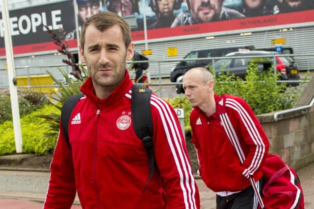 Aberdeen midfielder Niall McGinn, and teammate Willo Flood, prepare to fly out. Picture: SNS